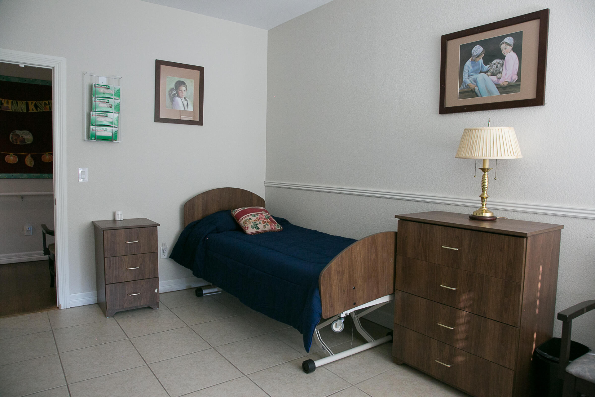 A bed with a dresser next to it.