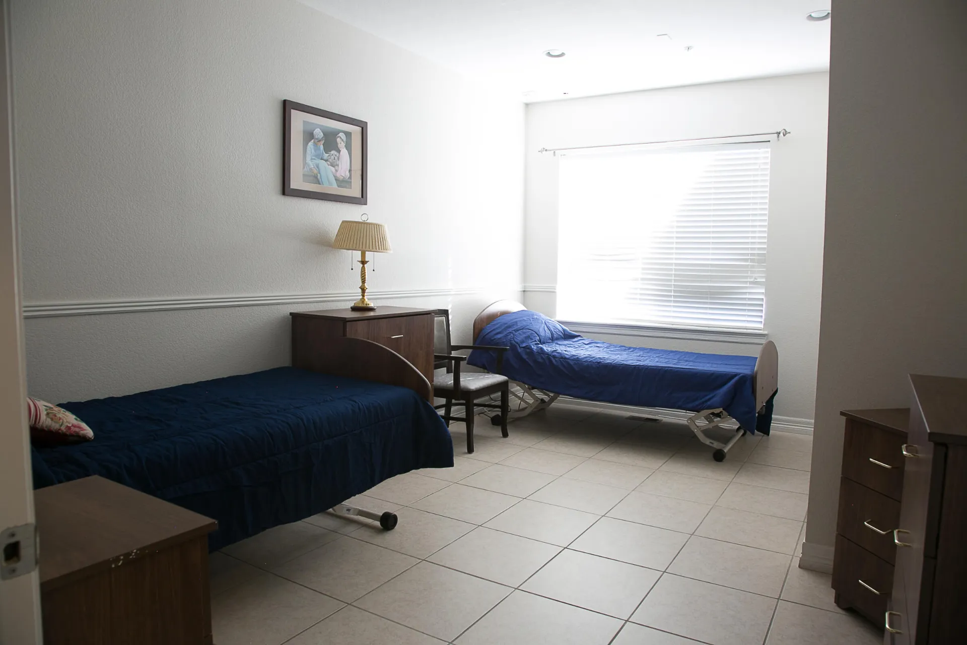 A bedroom with two beds.